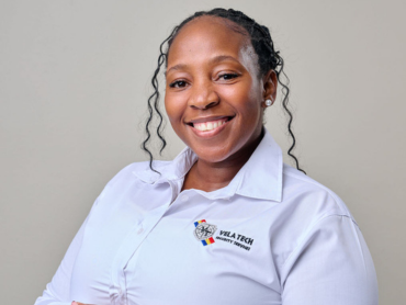 A Vela-Tech Security head office staff member in uniform